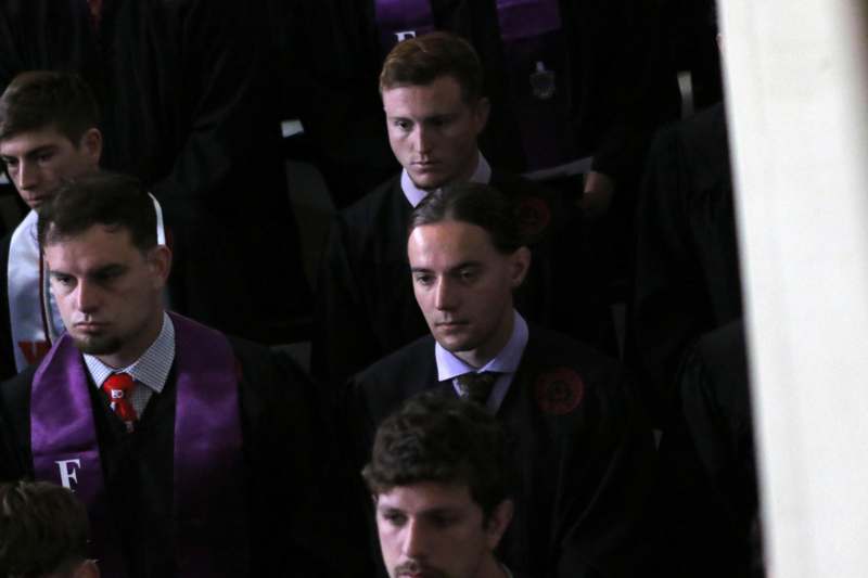a group of men in black robes