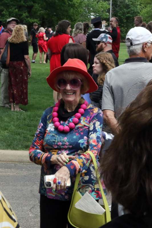 a woman wearing a red hat and sunglasses