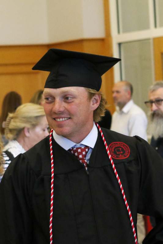 a man in a graduation gown