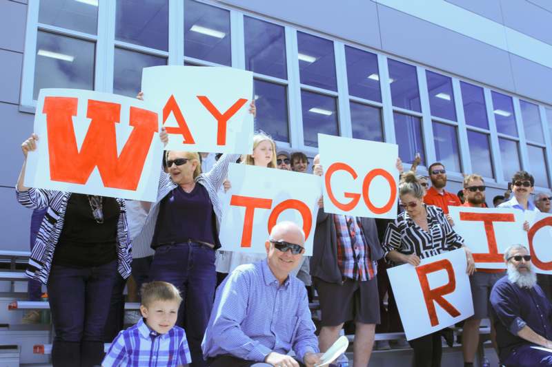 a group of people holding up signs