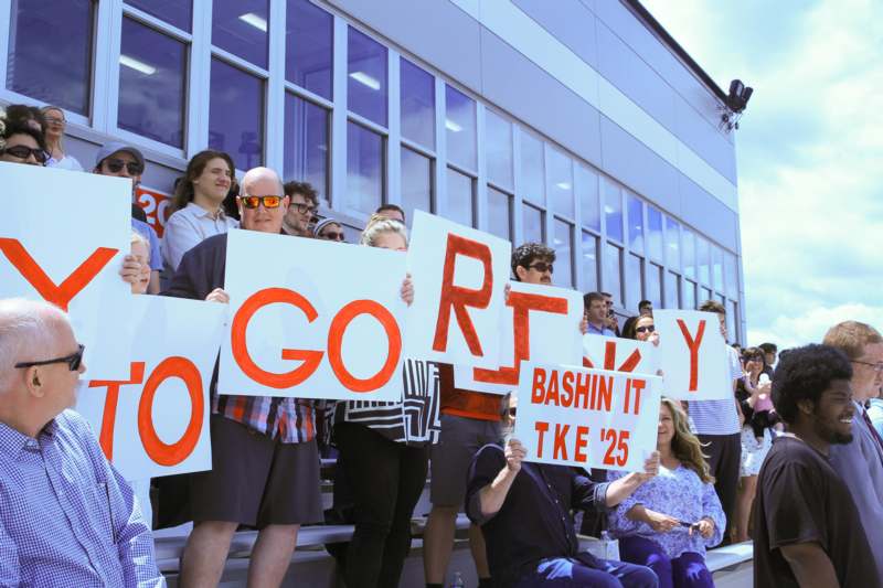 a group of people holding signs