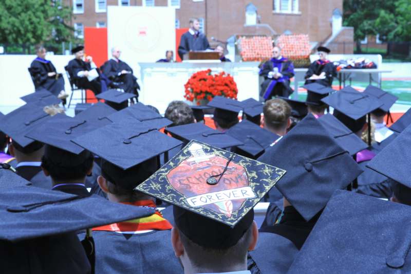 a group of people in graduation caps