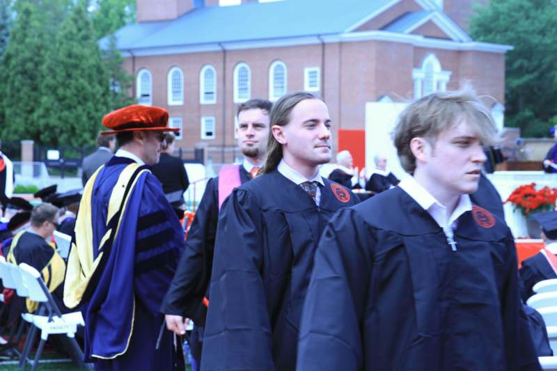 a group of people in graduation gowns