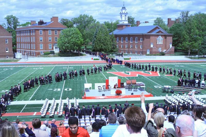 a group of people on a football field