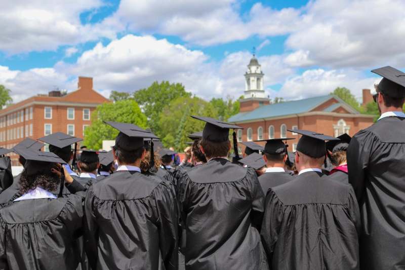 a group of graduates in black gowns and caps