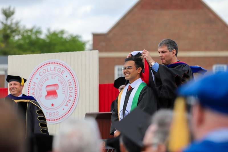 a man in a graduation gown