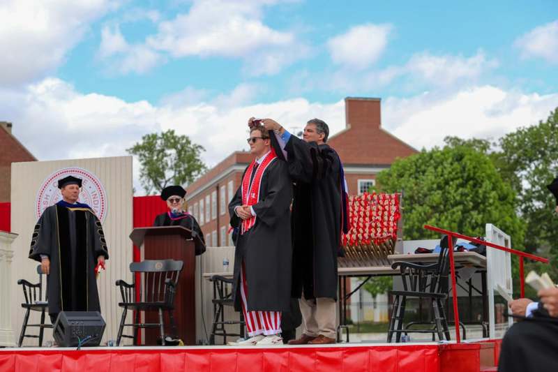 a group of people wearing graduation gowns
