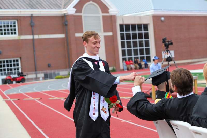 a man in a graduation gown