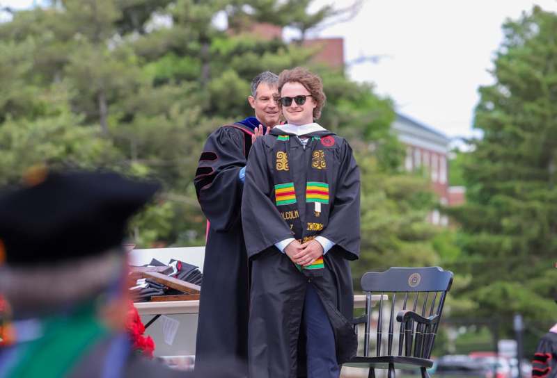 a man in a graduation gown