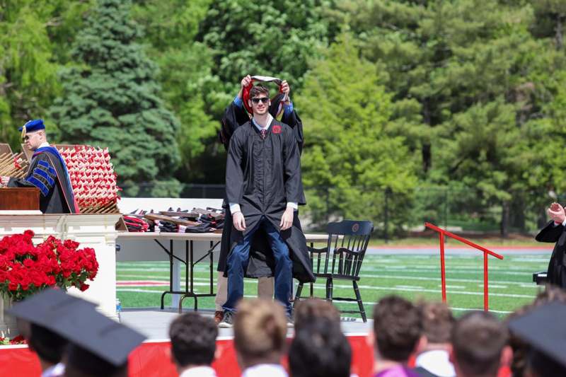a man in a graduation gown