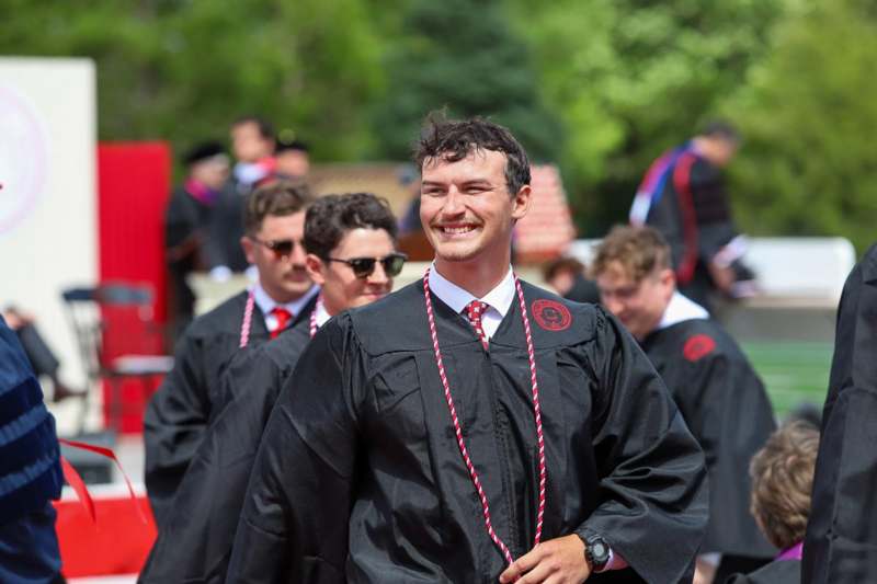 a group of people wearing graduation gowns