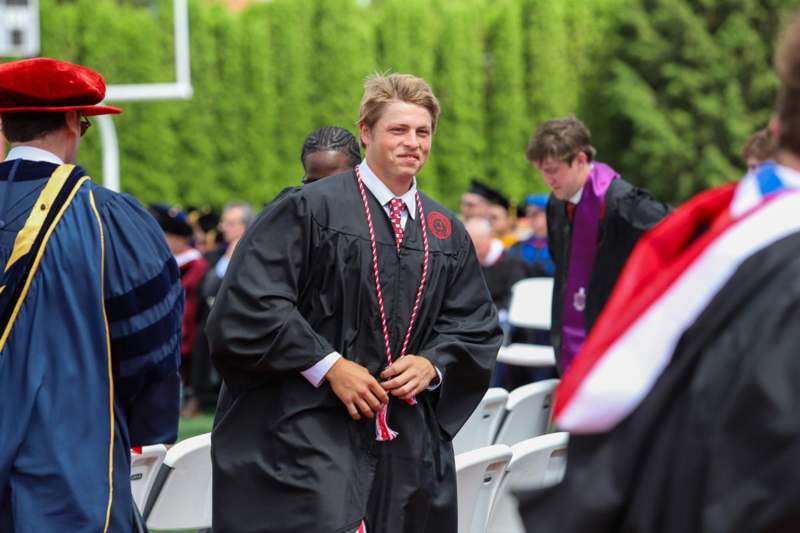 a man in a graduation gown