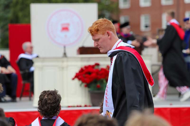 a man in a graduation gown