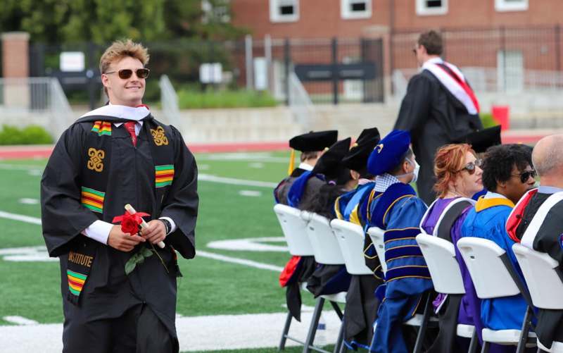 a man in a graduation gown