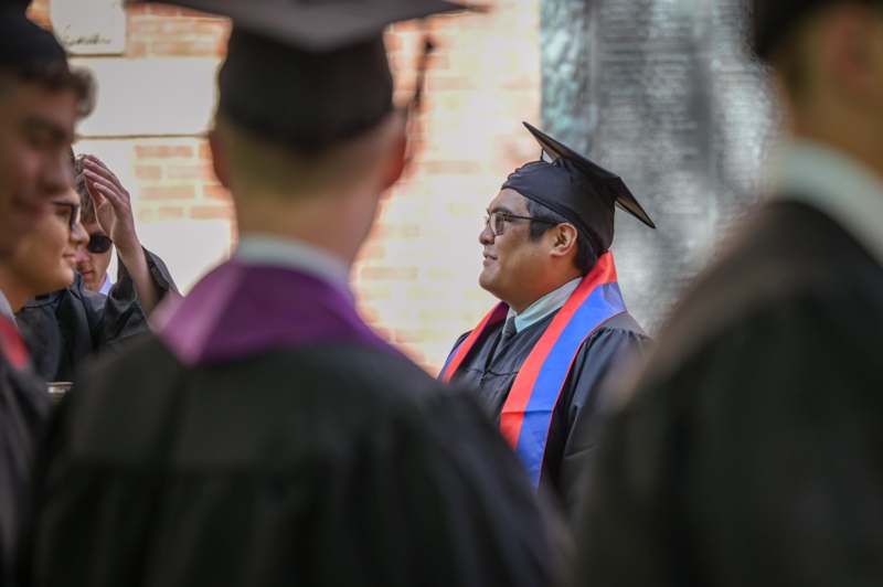 a man in a graduation gown
