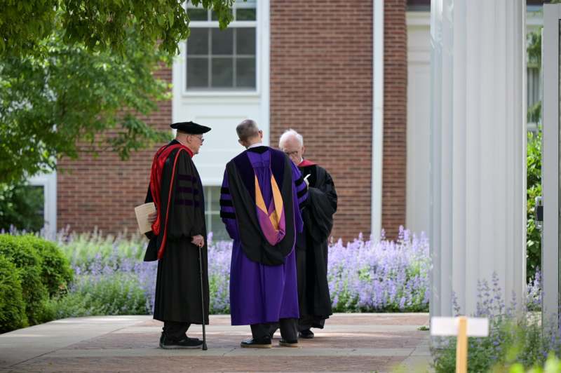a group of men in graduation robes