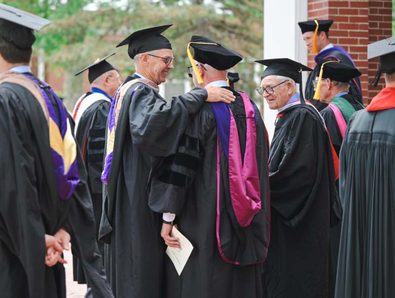 a group of people in graduation gowns