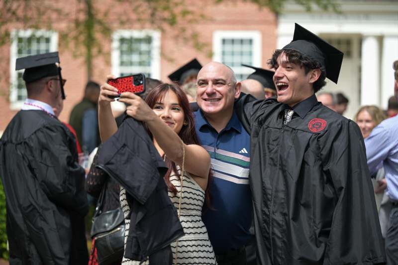 a group of people taking a selfie