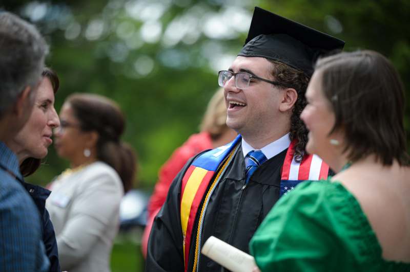 a man in a graduation gown and cap