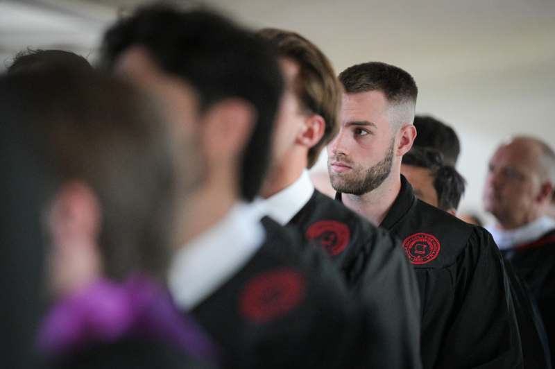 a group of men in black robes