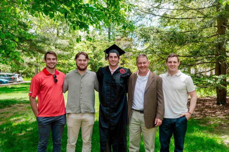 a group of men standing together in a line