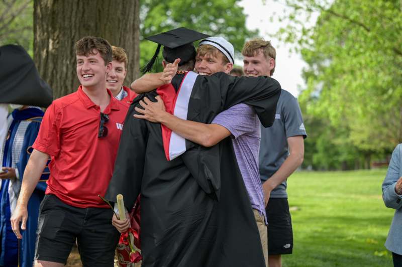 a man hugging another man