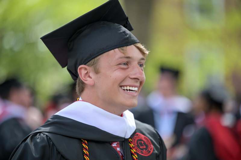 a man in a graduation gown