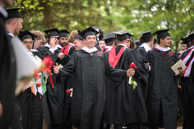 a group of people in graduation gowns