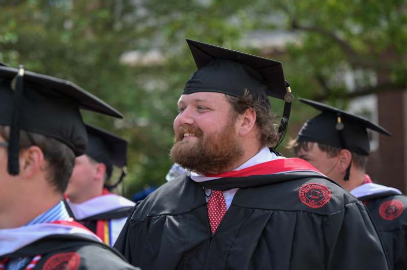 a man in a graduation gown