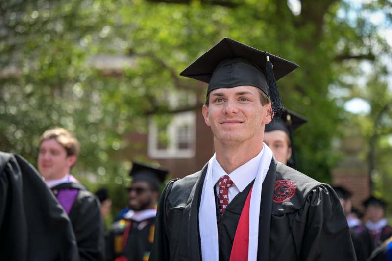 a man in a graduation gown