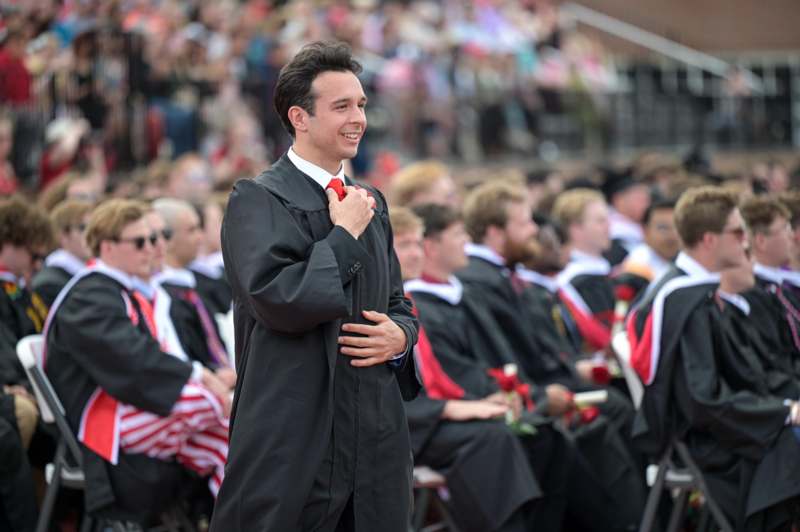 a man in a robe and tie