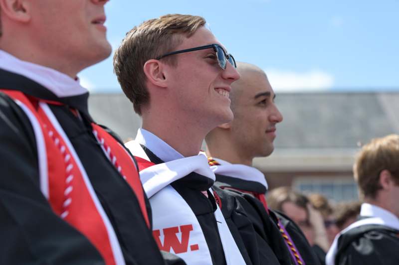 a group of men in graduation attire