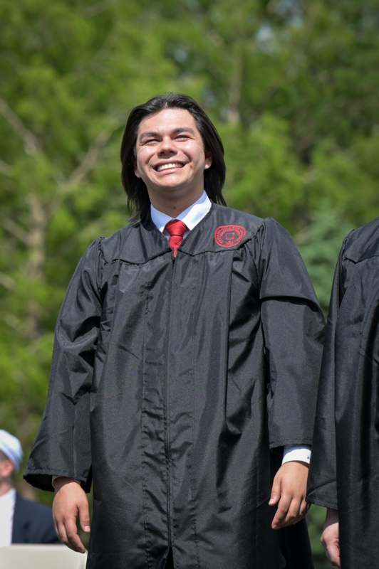 a man in a graduation gown