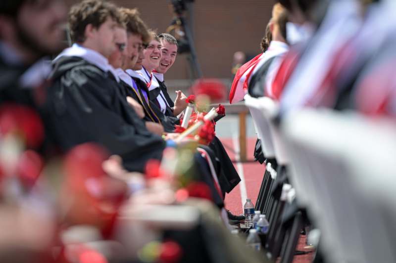 a group of people sitting on chairs