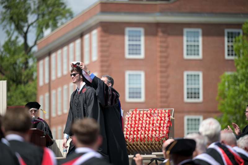 a man in a black robe and cap