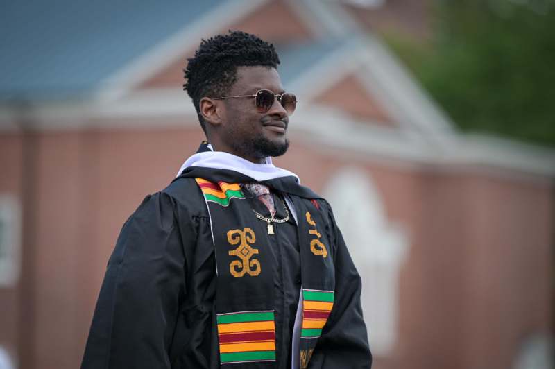 a man wearing a graduation gown
