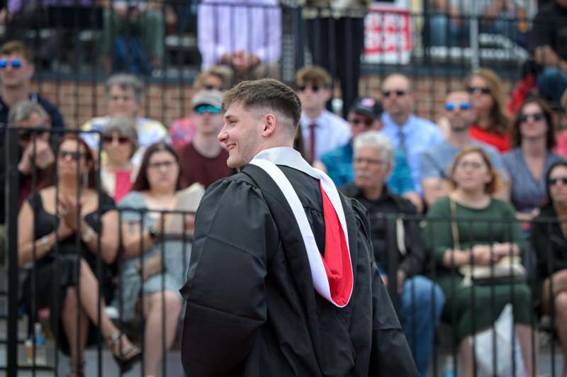a man in a graduation gown