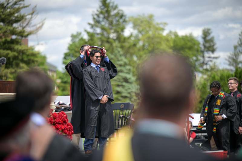 a man in a graduation gown