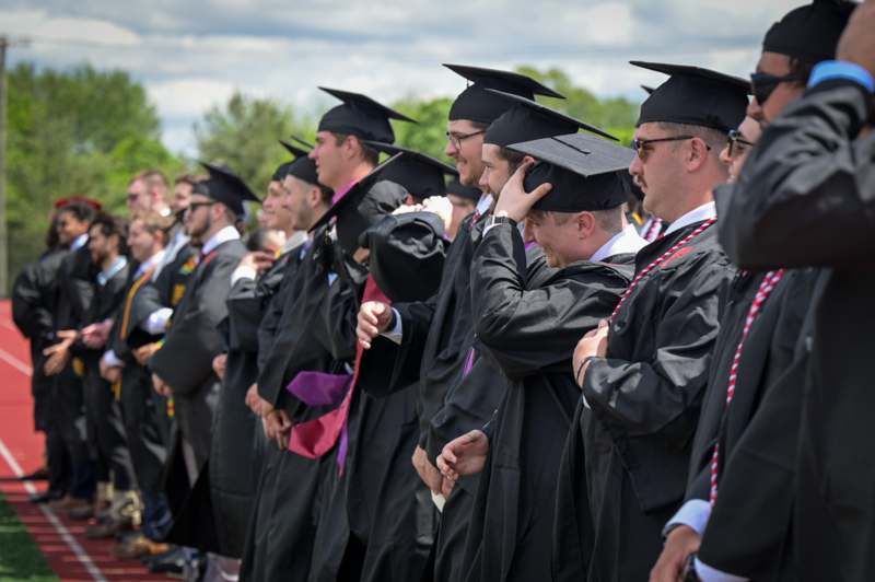 a group of people in graduation gowns
