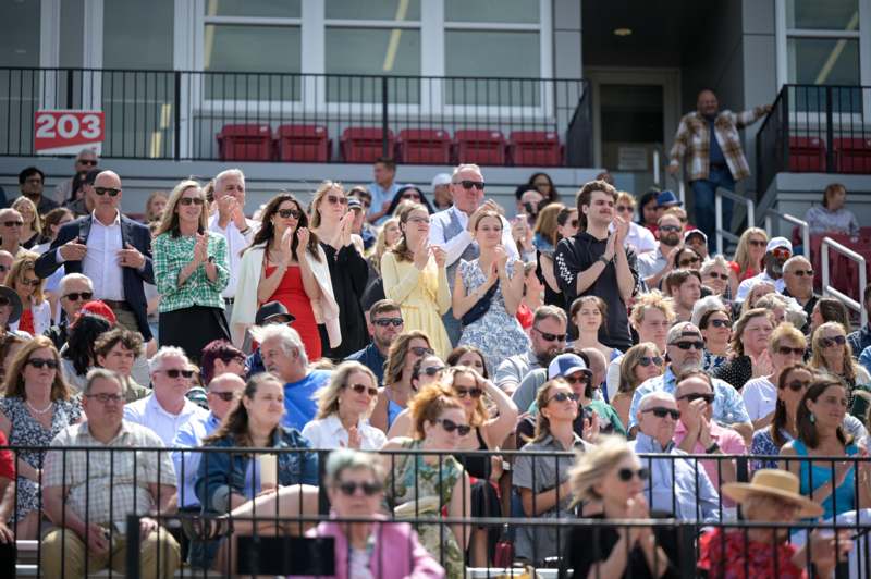 a group of people standing in a stadium