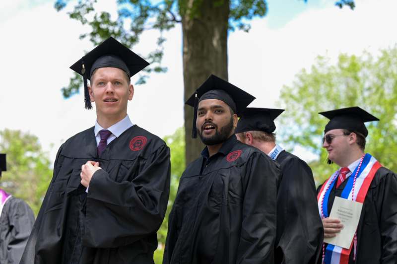 a group of men in graduation gowns