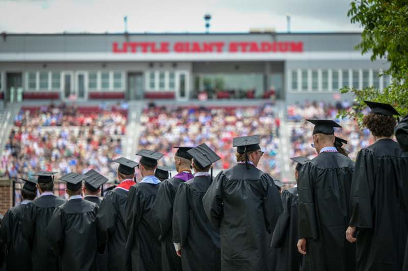 a group of graduates in black gowns and caps