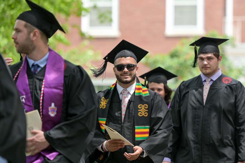 a group of people wearing graduation gowns and caps