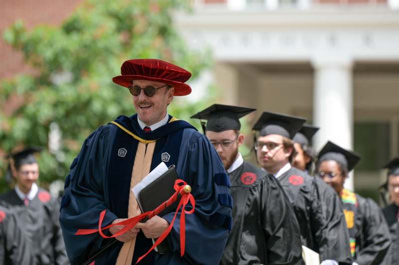 a group of people in graduation gowns and caps