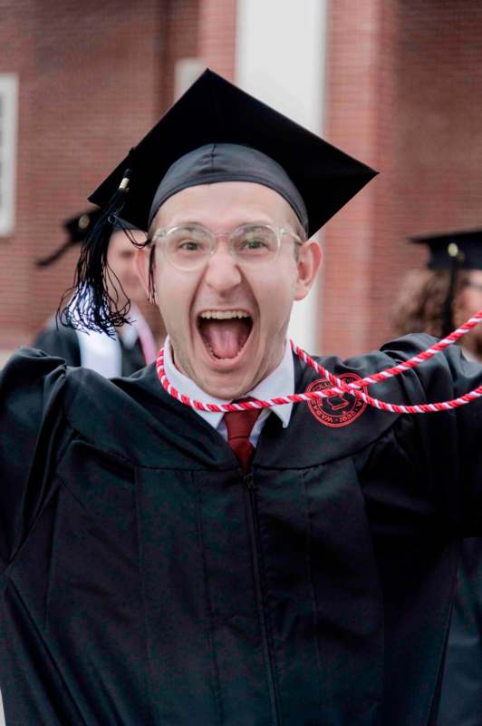 a man in a graduation gown