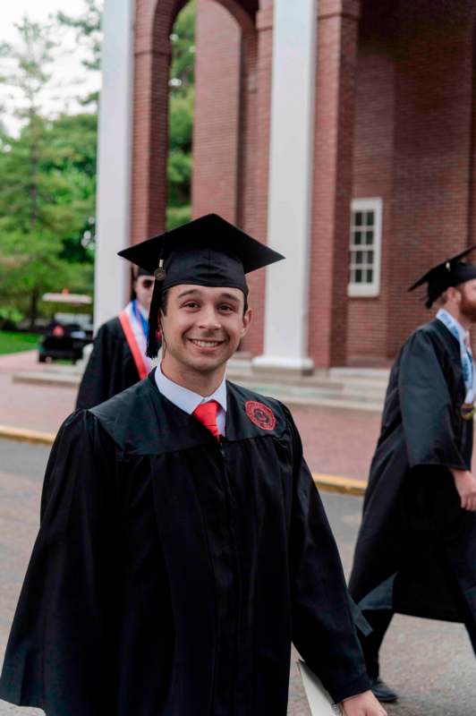 a man in a graduation gown