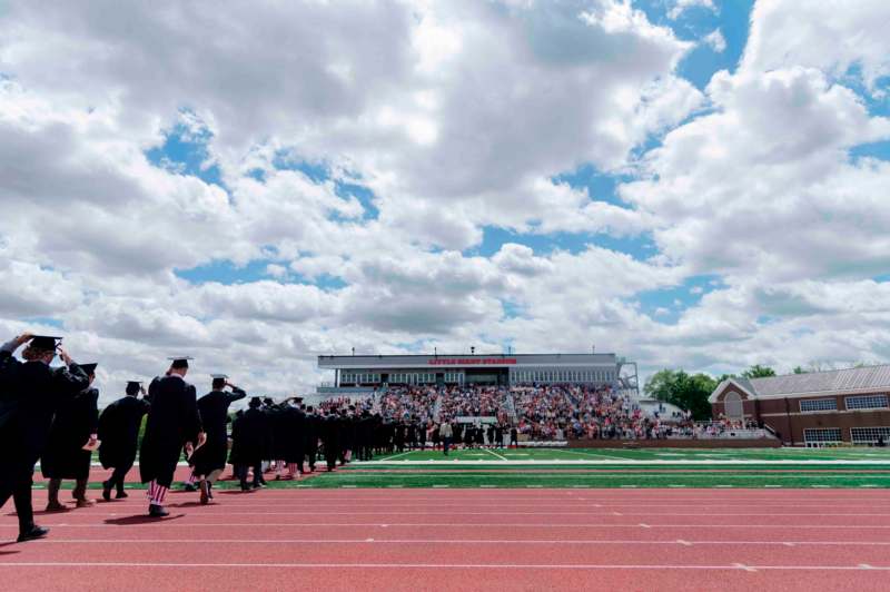 a group of people standing on a track