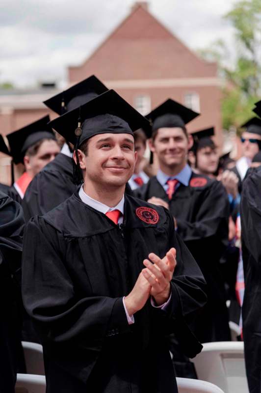 a man in a graduation gown