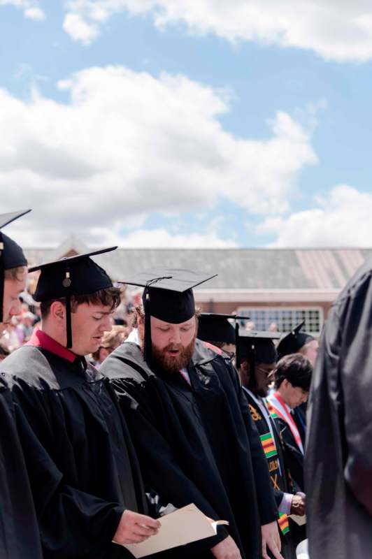 a group of people wearing graduation gowns