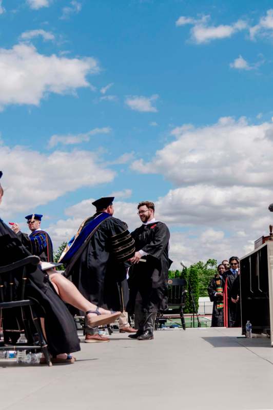 a group of people in graduation gowns